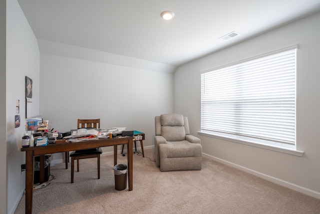 home office with light carpet and vaulted ceiling