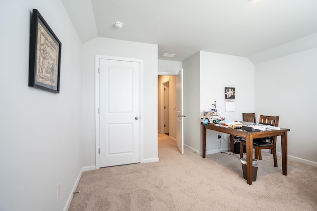 office area with light colored carpet and lofted ceiling