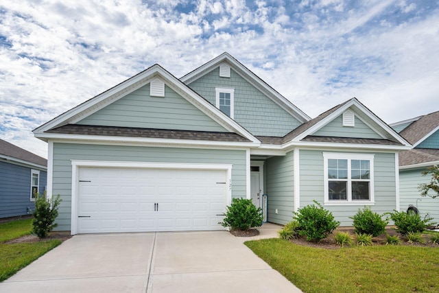 craftsman-style home with a front lawn and a garage