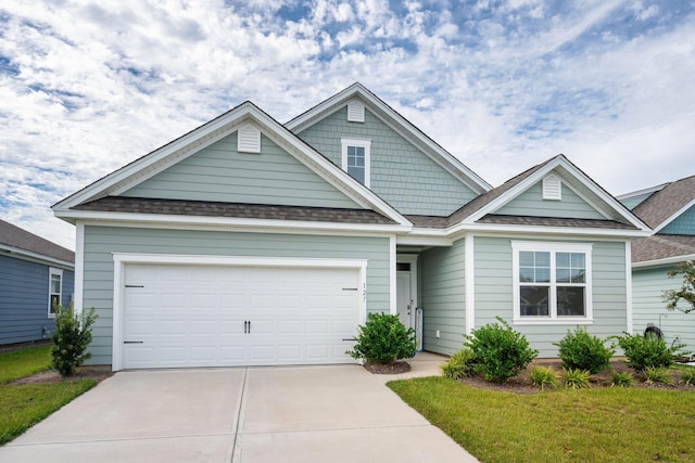 127 William Clark Blvd, Santee, SC 29142 - view of front facade with driveway, an attached garage, and a shingled roof
