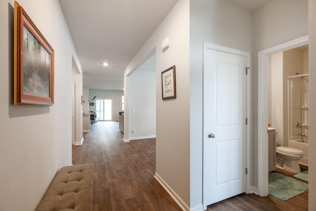 hallway with dark wood-type flooring