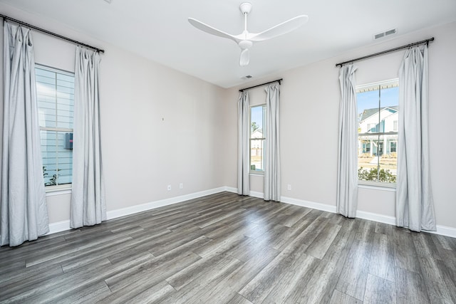 spare room with ceiling fan and wood-type flooring