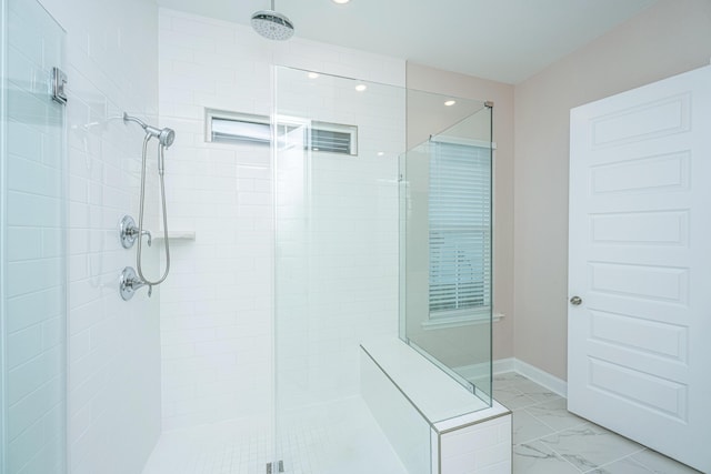 bathroom featuring tiled shower