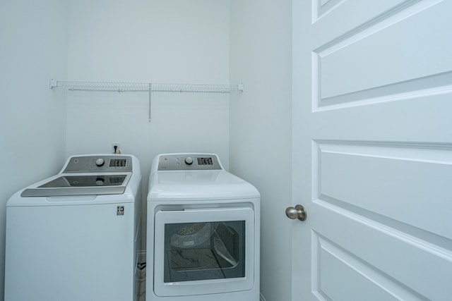 washroom with washer and dryer