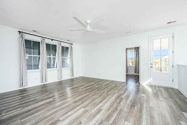 unfurnished room featuring ceiling fan and light hardwood / wood-style flooring