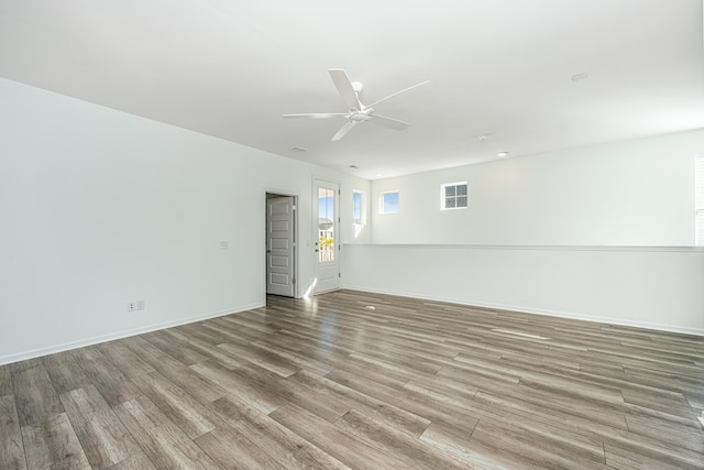 unfurnished room featuring light hardwood / wood-style flooring and ceiling fan