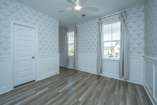 unfurnished bedroom featuring hardwood / wood-style floors and ceiling fan