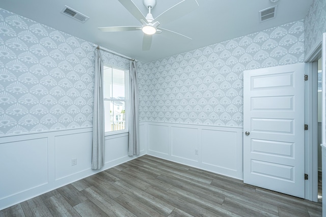 empty room featuring ceiling fan and wood-type flooring