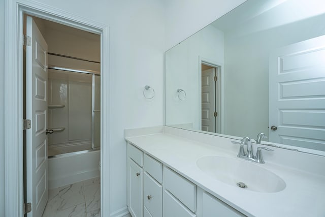 bathroom featuring vanity and combined bath / shower with glass door