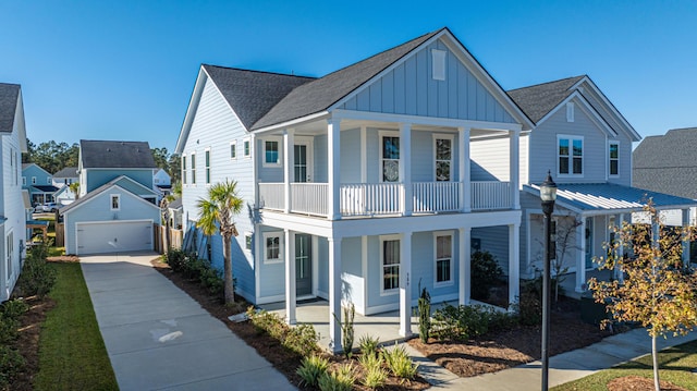 view of front of home featuring covered porch, a balcony, and a garage