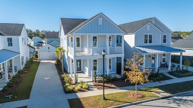 view of front of home featuring a porch, a garage, and an outdoor structure