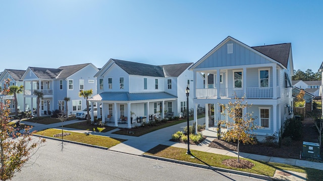 view of front of property featuring covered porch and a balcony