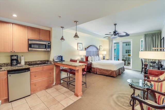 carpeted bedroom featuring access to outside