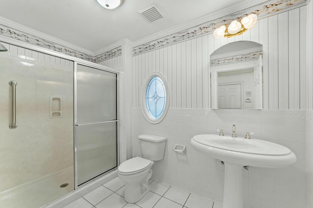 bathroom featuring tile patterned floors, walk in shower, and ornamental molding