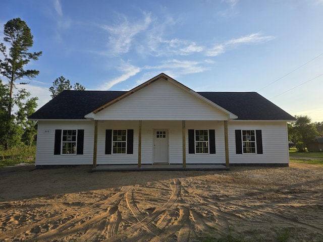 single story home featuring a porch