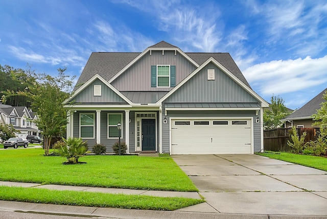 craftsman inspired home with concrete driveway, a garage, a front yard, a standing seam roof, and fence
