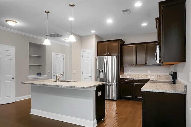 kitchen featuring dark brown cabinets, appliances with stainless steel finishes, a sink, and visible vents