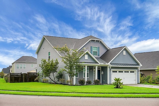 craftsman-style home with driveway, board and batten siding, a garage, a front lawn, and a standing seam roof