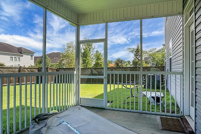 unfurnished sunroom featuring a residential view