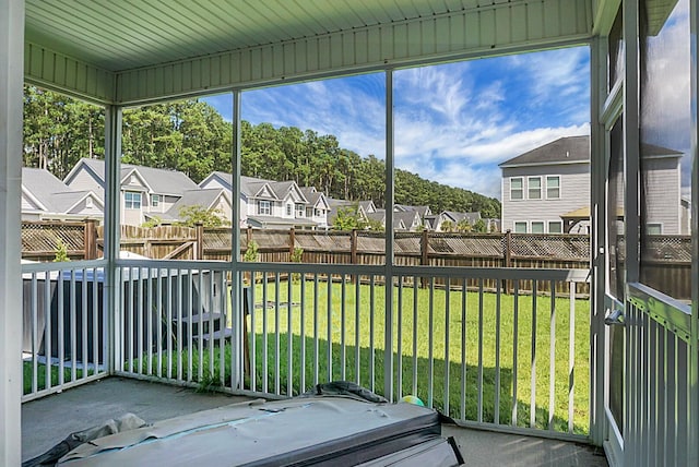 sunroom / solarium with a residential view