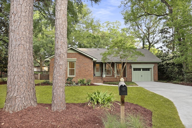 single story home with brick siding, an attached garage, driveway, and a front lawn