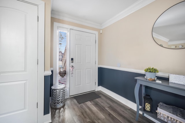 entryway featuring baseboards, dark wood finished floors, and crown molding