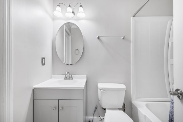 bathroom with toilet,  shower combination, and vanity