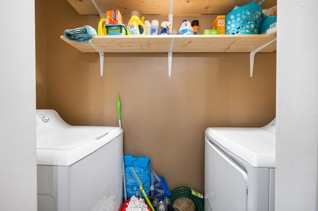 washroom with washer and dryer