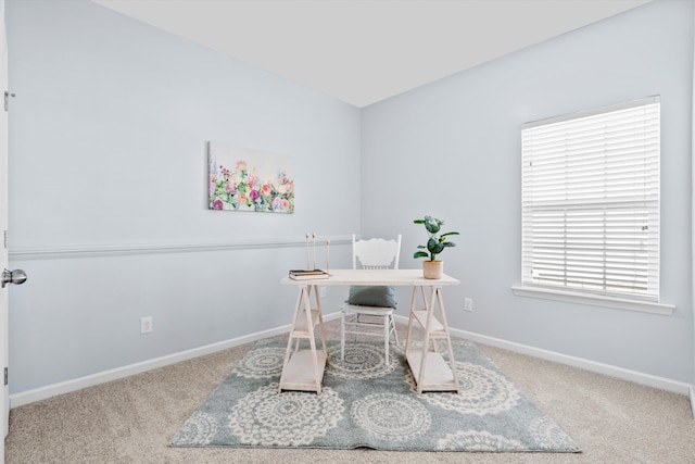 office space with baseboards and carpet flooring