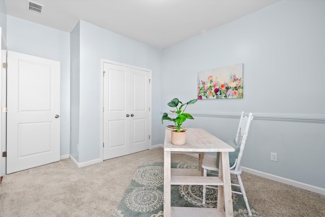 home office with baseboards, visible vents, and carpet floors