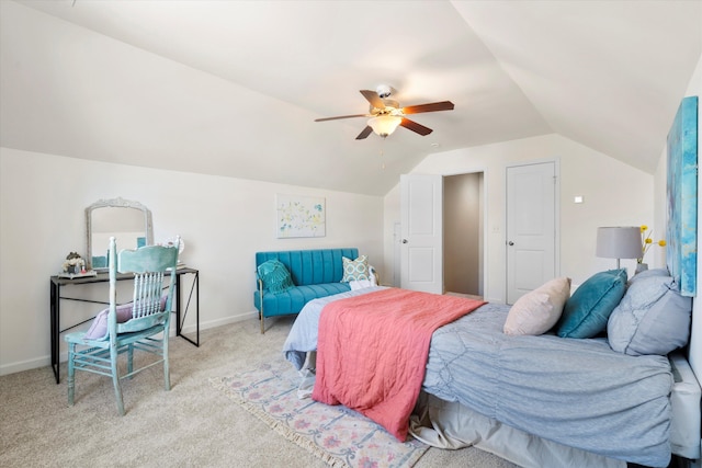 bedroom featuring baseboards, light carpet, ceiling fan, and vaulted ceiling