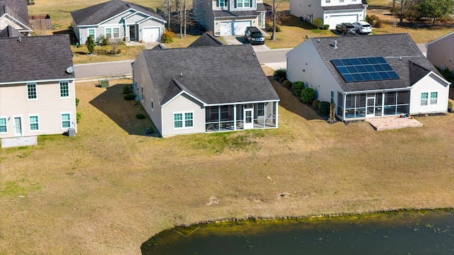 birds eye view of property featuring a residential view and a water view