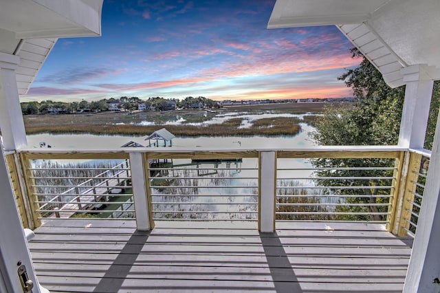 deck at dusk with a water view