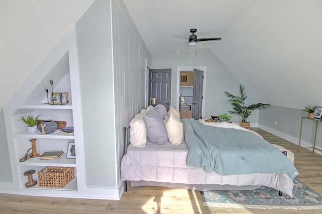 bedroom featuring ceiling fan, lofted ceiling, and light hardwood / wood-style floors