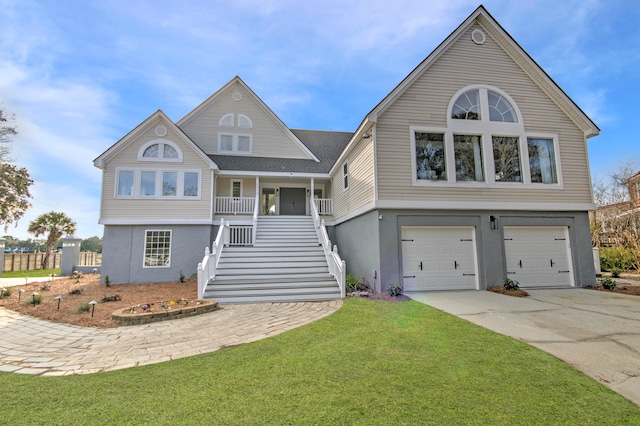 view of front of house featuring a front yard and a garage