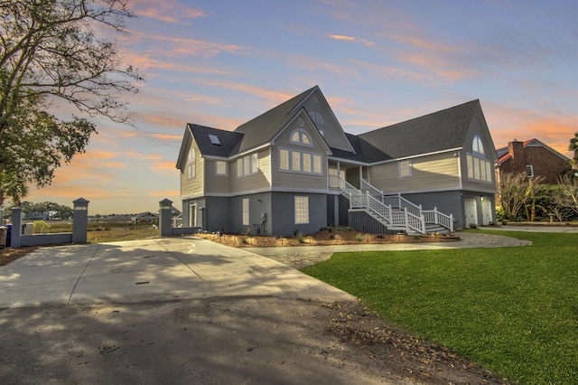 view of front facade featuring a yard and a garage