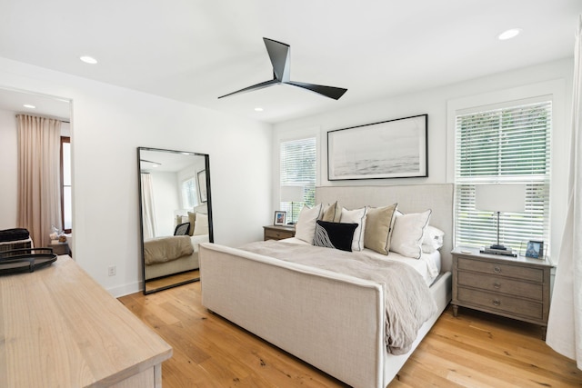 bedroom featuring light hardwood / wood-style flooring and ceiling fan