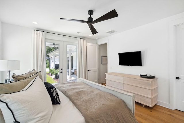 bedroom with hardwood / wood-style flooring, access to outside, french doors, and ceiling fan