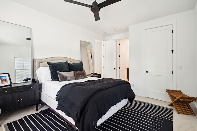 bedroom with ceiling fan and carpet flooring