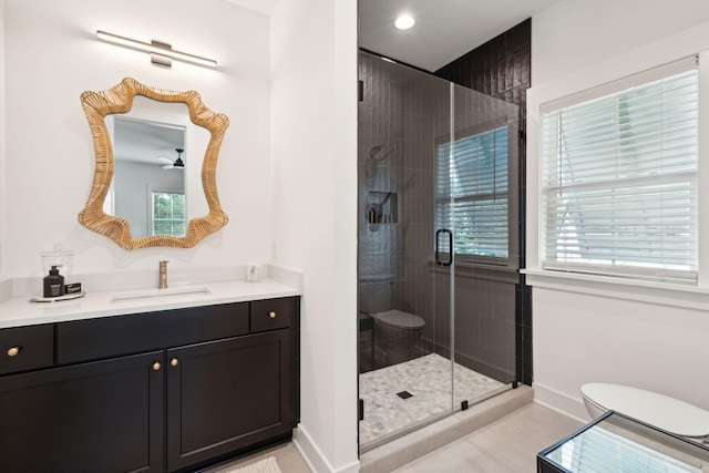 bathroom with vanity, a shower with shower door, tile patterned floors, and toilet