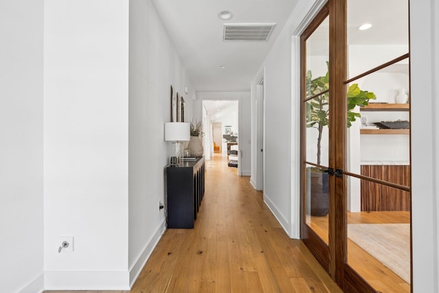 hallway featuring light hardwood / wood-style floors