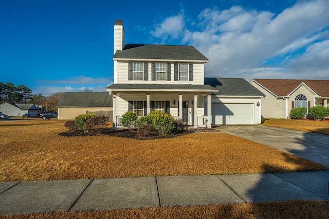 colonial house with a garage, a front yard, and covered porch