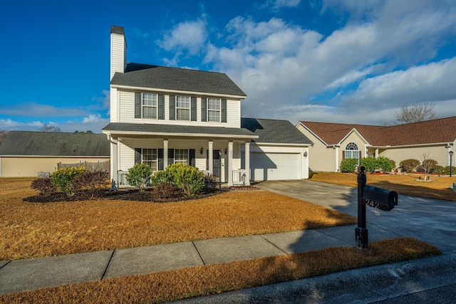 colonial home featuring a garage, a front yard, and covered porch