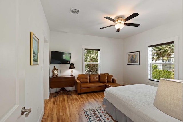 31 W 9th St, Folly Beach, SC 29439 - bedroom featuring light wood-type flooring and a ceiling fan