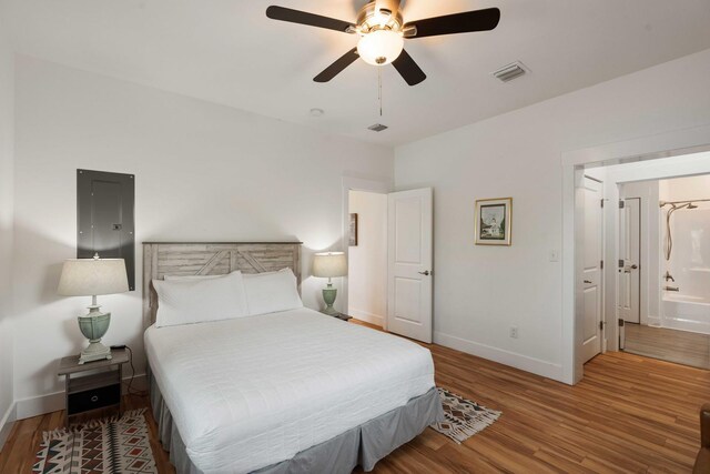 31 W 9th St, Folly Beach, SC 29439 - bedroom featuring wood finished floors and a ceiling fan