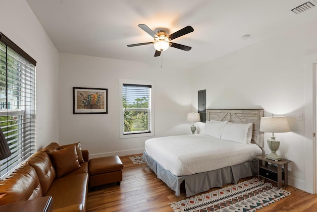 31 W 9th St, Folly Beach, SC 29439 - bedroom with wood finished floors and a ceiling fan