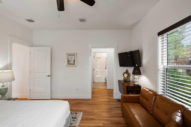 31 W 9th St, Folly Beach, SC 29439 - bedroom with light wood-style floors and a ceiling fan