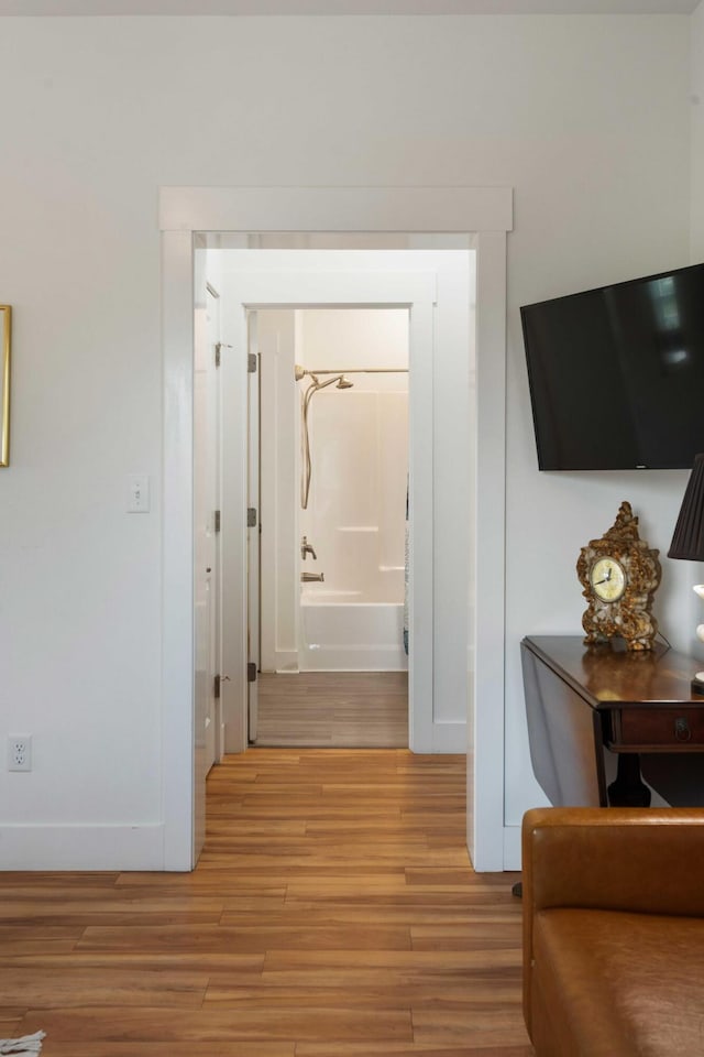 31 W 9th St, Folly Beach, SC 29439 - hall with light wood-style flooring and baseboards