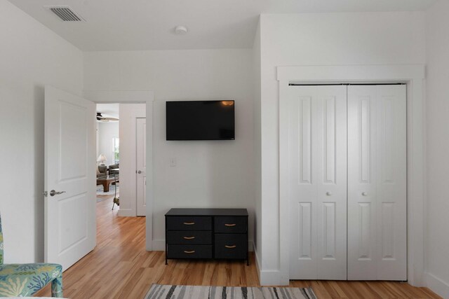 31 W 9th St, Folly Beach, SC 29439 - bedroom with light wood-type flooring and a closet