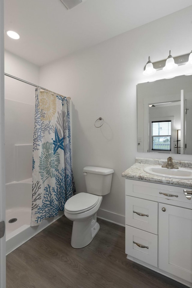 31 W 9th St, Folly Beach, SC 29439 - full bath with wood finished floors, vanity, and a shower with curtain